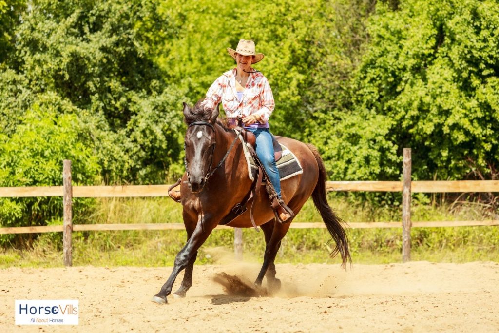 a lady riding a horse with western bridle and showing some western riding principles