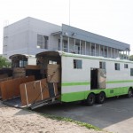 two repo horse trailers parked on the road