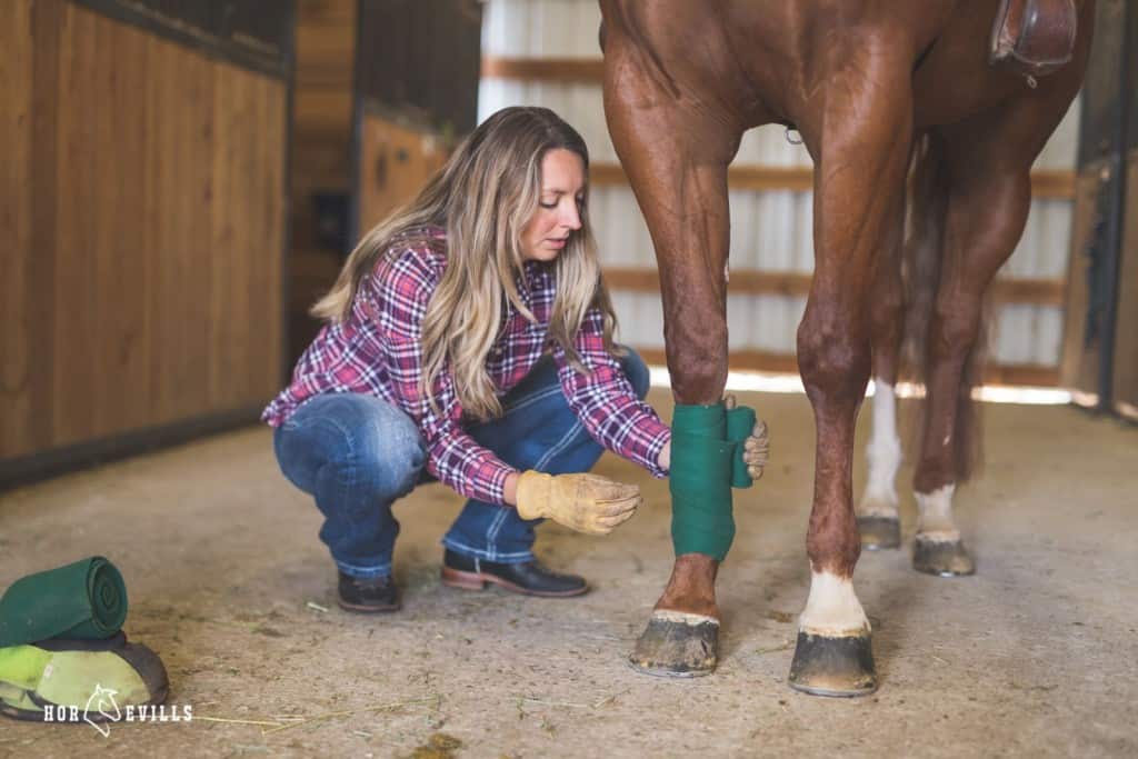 women wrapping homemade ice boots for horses